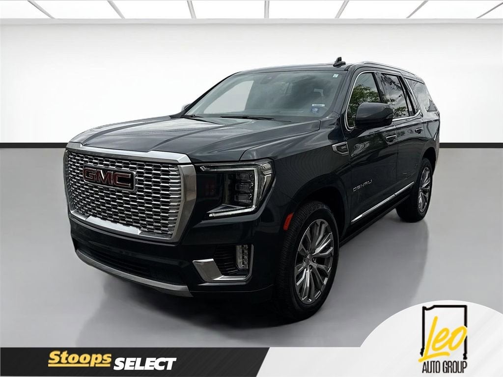 2021 GMC Yukon Denali in Hunter Metallic — front three-quarter view
