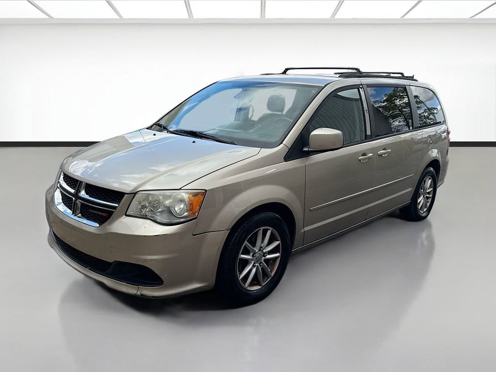 2013 Dodge Grand Caravan SXT in Gold — front three-quarter view
