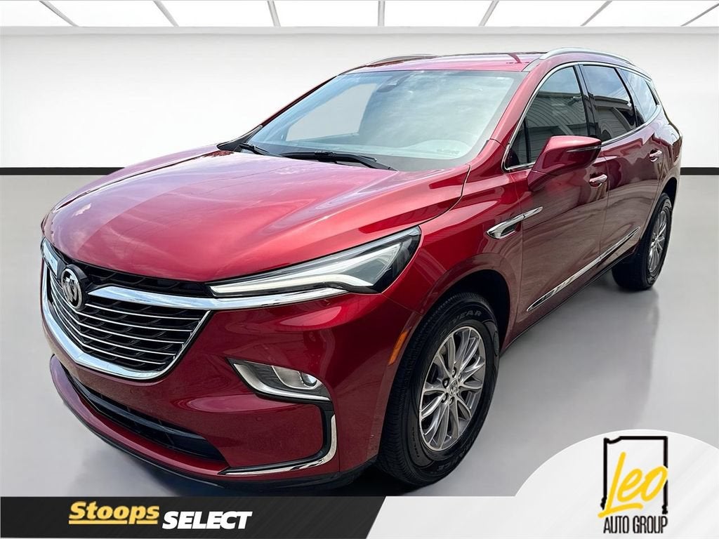 2023 Buick Enclave Essence in Cherry Red Tintcoat — front three-quarter view