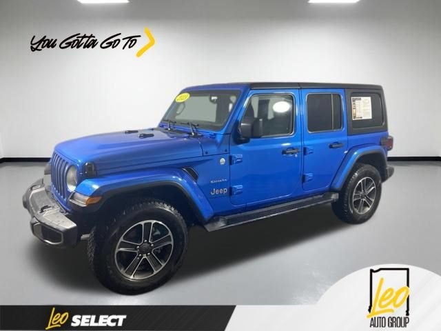 2023 Jeep Wrangler 4-Door Sahara 4x4 in Blue — front three-quarter view