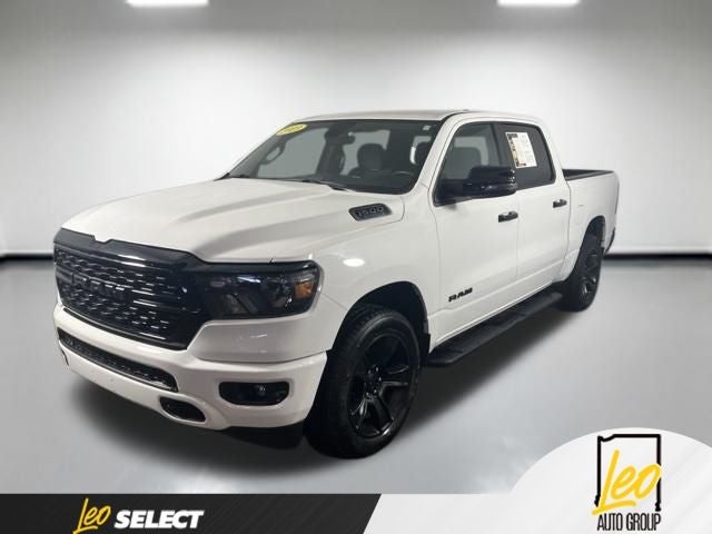 2023 RAM 1500 Big Horn Crew Cab 4x4 5'7' Box in Bright White Clearcoat — front three-quarter view