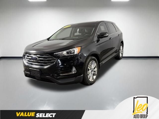 2021 Ford Edge Titanium in Agate Black Metallic — front three-quarter view