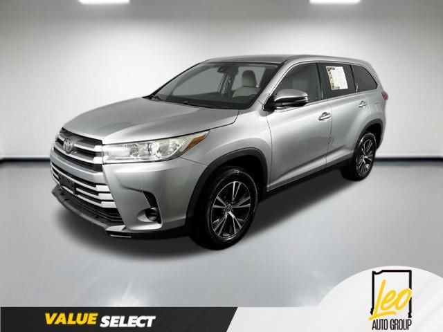 2019 Toyota Highlander LE in Celestial Silver Metallic — front three-quarter view