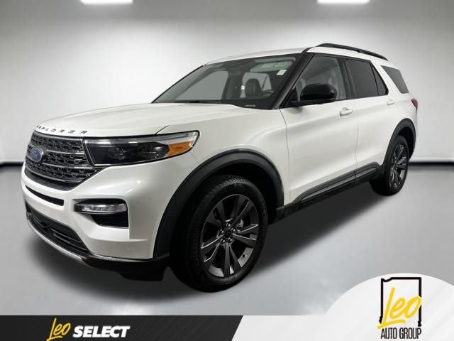 2023 Ford Explorer XLT in White Metallic — front three-quarter view