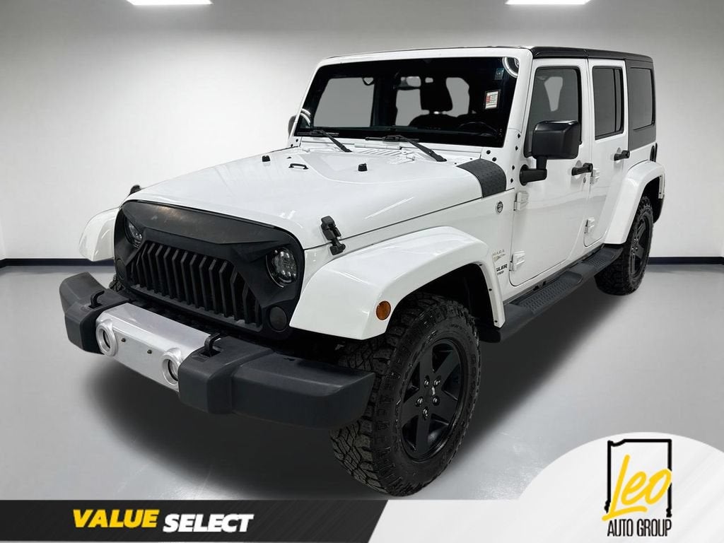 2015 Jeep Wrangler Unlimited Sahara in White — front three-quarter view